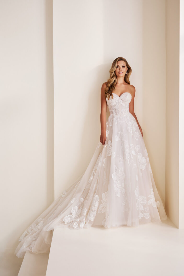 Full-length front view of the E603 ivory A-line bridal gown with sweetheart neckline and floral lace appliqué