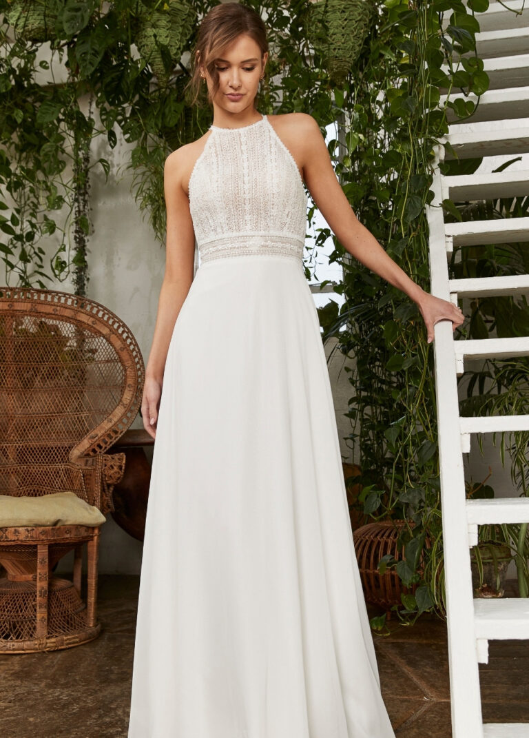 Full-length front view of the PB301 ivory soft-flowing A-line gown with high neckline and lace bodice