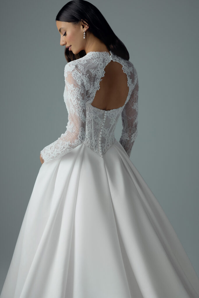 Close rear view of the Bree bridal gown showing the lace sleeves and keyhole back