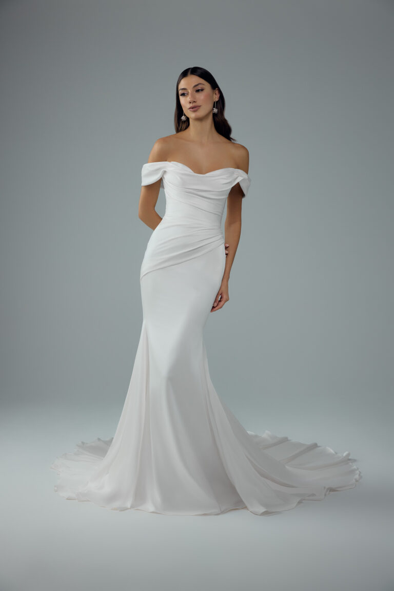Full-length front view of the Ava Y3222 ivory fit-and-flare bridal gown with off-the-shoulder neckline