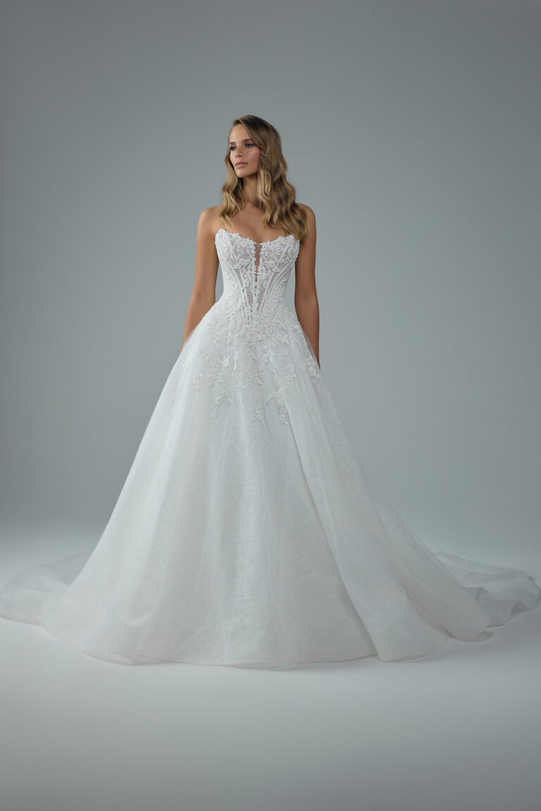 Full-length front view of the Neeve Y3237 ivory and white ball gown with lace bodice and full tulle skirt