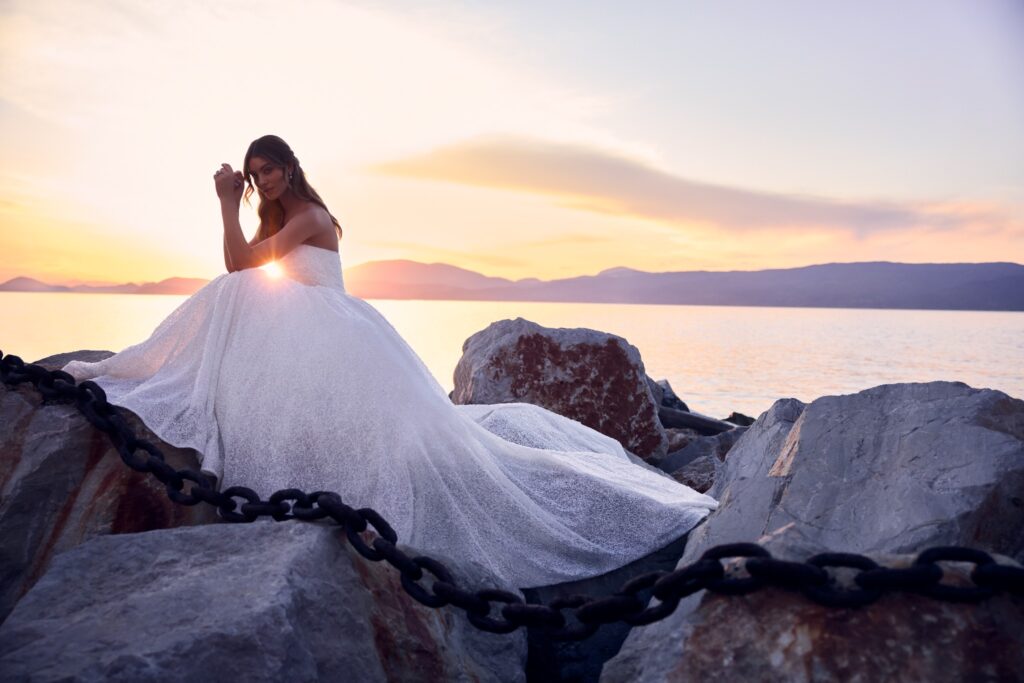 Bride in a flowing gown at sunset